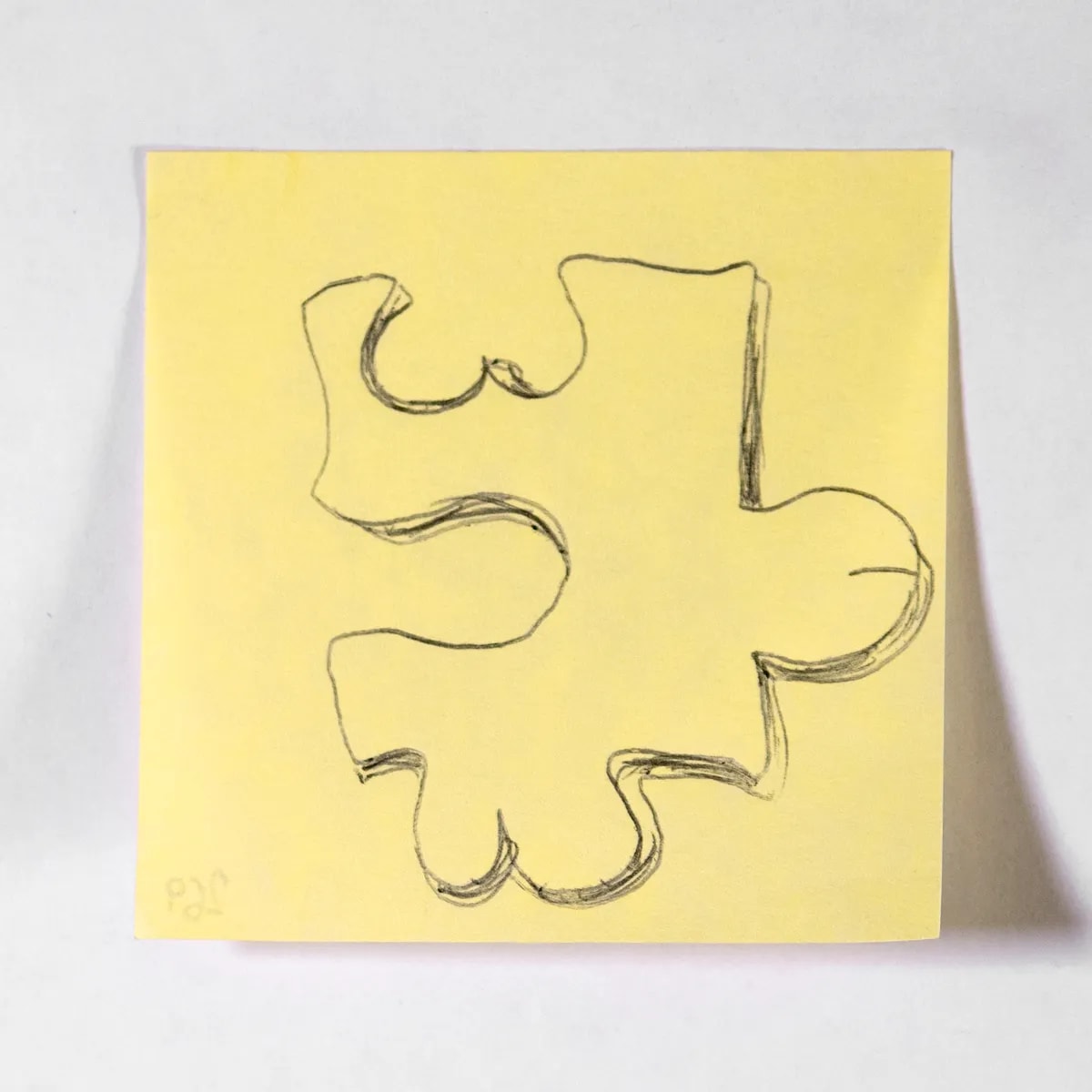 Puzzle, No. 269 of 512: a hand-drawn cazzo on a sticky note