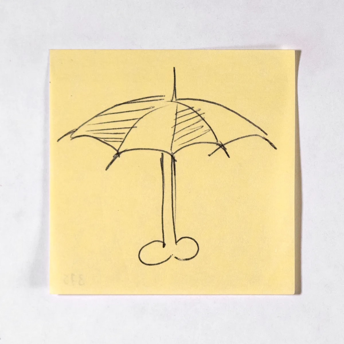 Umbrella, No. 375 of 512: a hand-drawn cazzo on a sticky note
